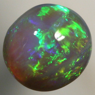 SOLID BLACK CRYSTAL OPAL Bright greens rolling flashes over a high dome